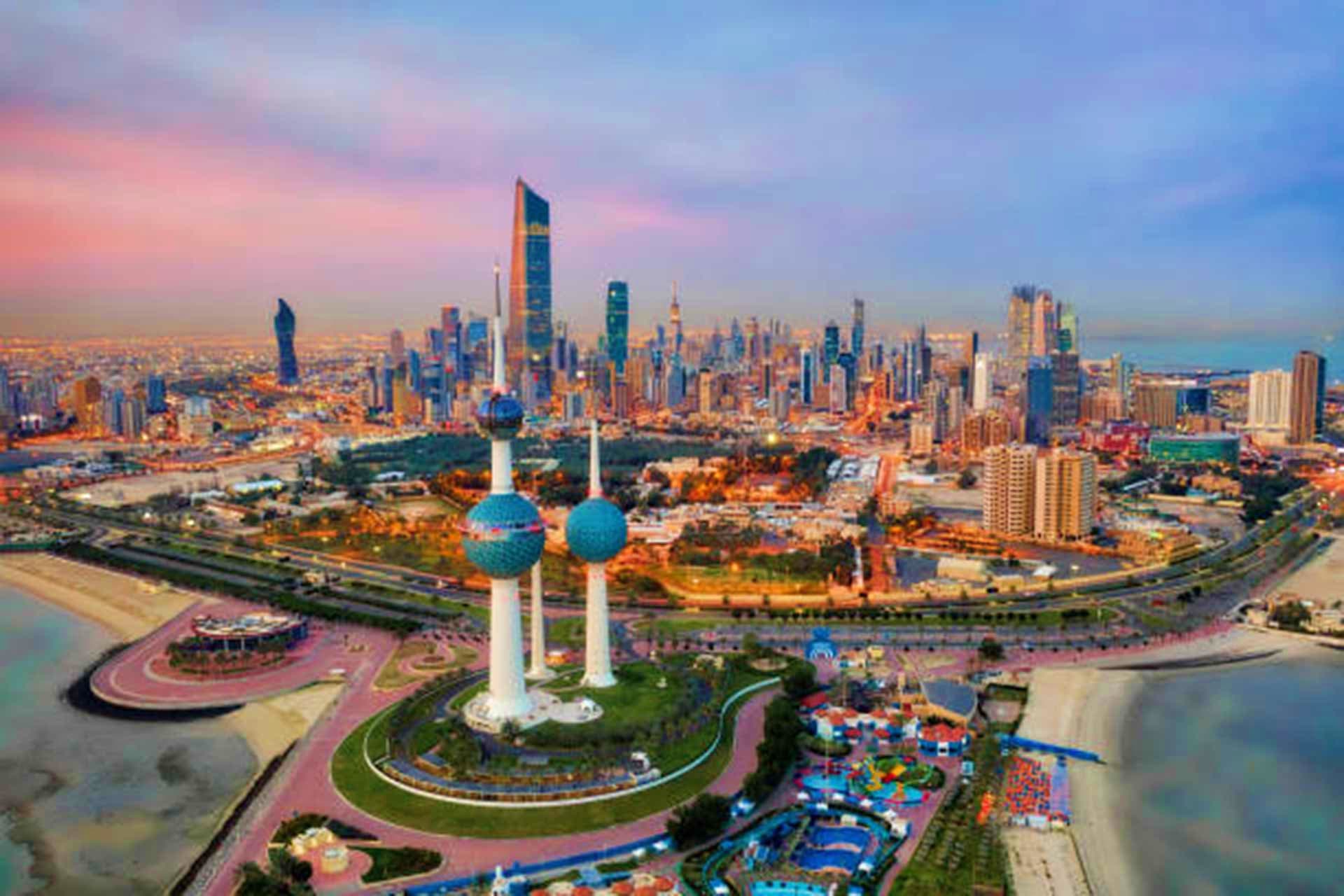 Kuwait Visa Aerial view of Kuwait City skyline with the distinctive Kuwait Towers landmark and modern skyscrapers along the Persian Gulf